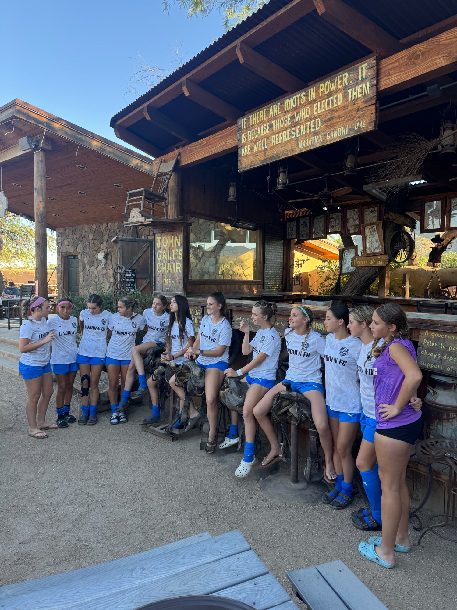 The team taking a break together outside a restaurant